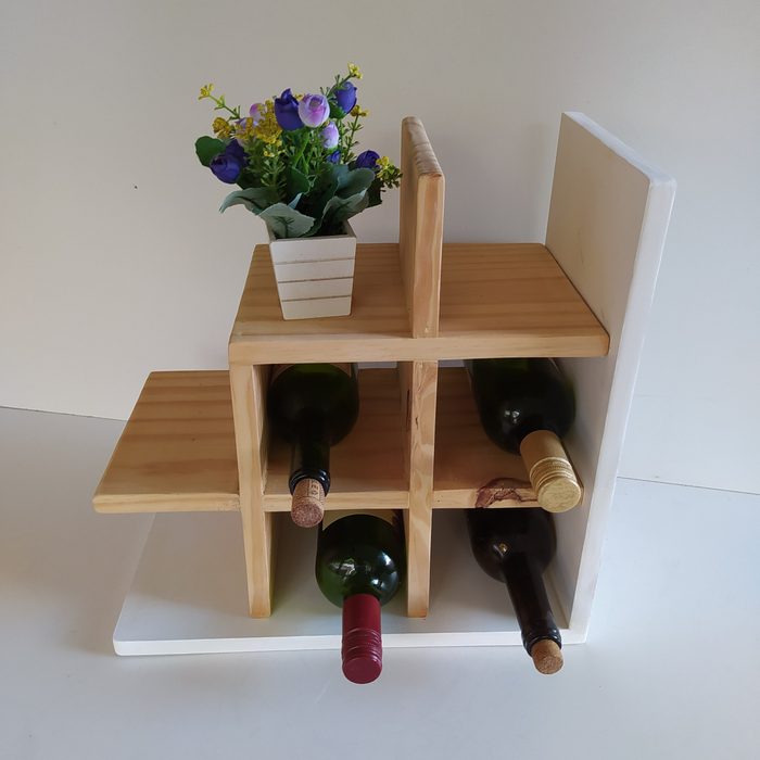 Suporte para vinho feito em oficina de reuso